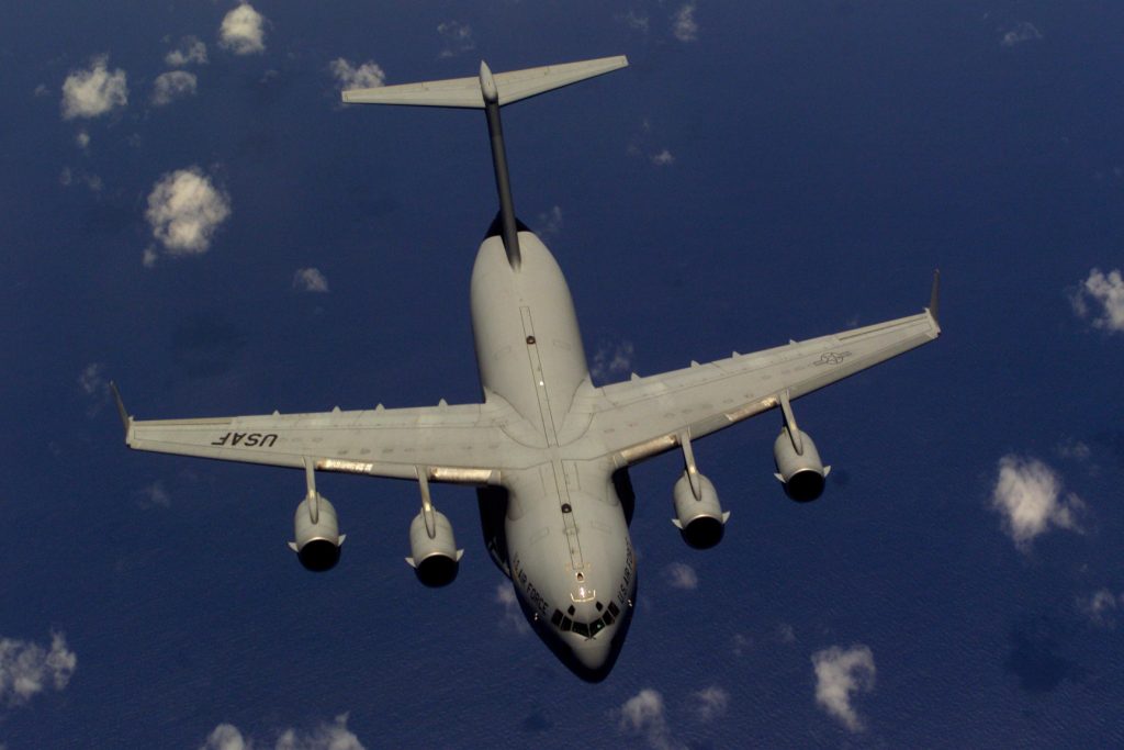 A C-17 Globemaster III from the 437th Air Wing, Charleston Air Force Base, South Carolina, flies away from a KC-10 Extender after being refueled off the coast of North Carolina. During Rodeo 2000, teams from all over the world will compete in areas including airdrop, aerial refueling, aircraft navigation, special tactics, short field landings, cargo loading, engine running on/offloads, aeromedical evacuations and security forces operations. From May 6 to 13, more than 80 aircraft representing more than 100 teams from 17 countries will bring in about 3,500 competitors, observers, umpires, and support people to Pope AFB, NC. USAF Photo by Staff Sergeant Sean M. Worrell.