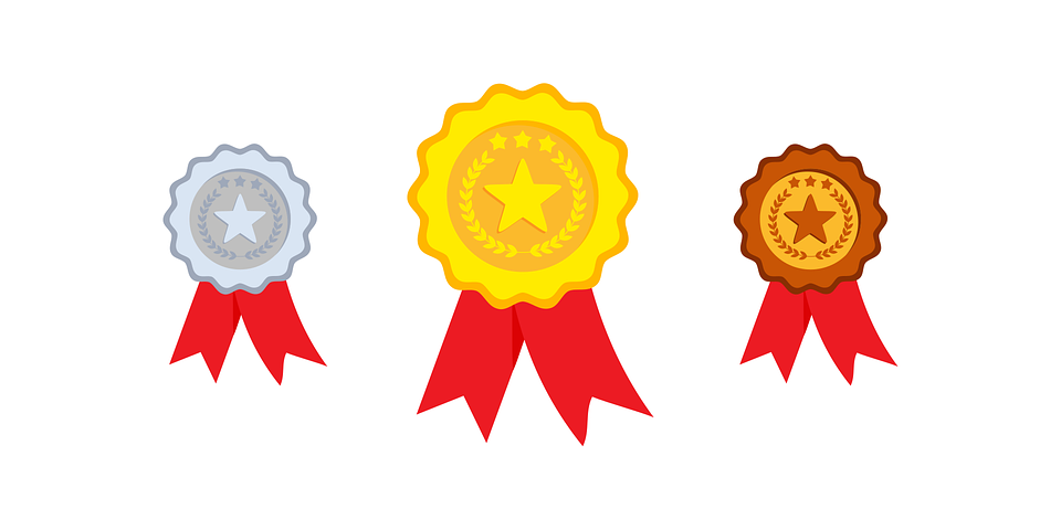 An illustration of gold, silver, and bronze medals displayed.