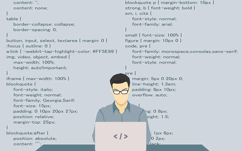 Image of a man working on a computer with a programming background