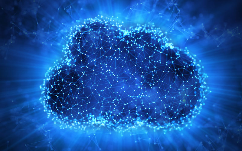 Image consisting of a cloud with multiple inter-connected nodes within it.