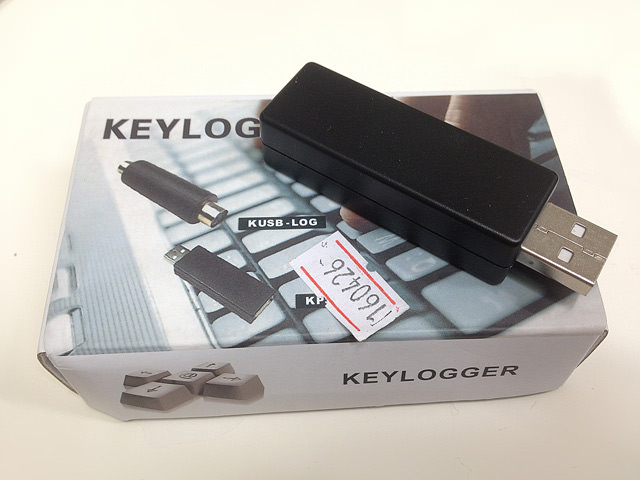Photograph of a keylogger on a box.