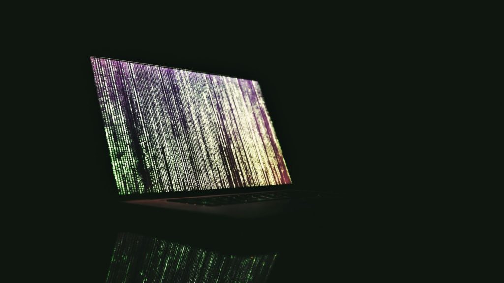 Image of Marix faux algorithms on a laptop.
