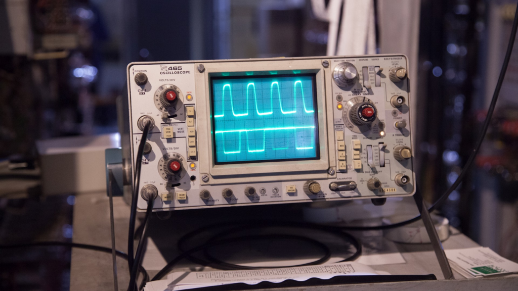 Image of an oscilloscope displaying two waveforms.