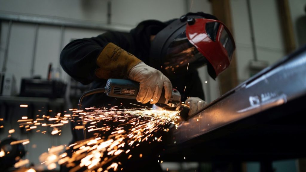 Image of a person welding metal.