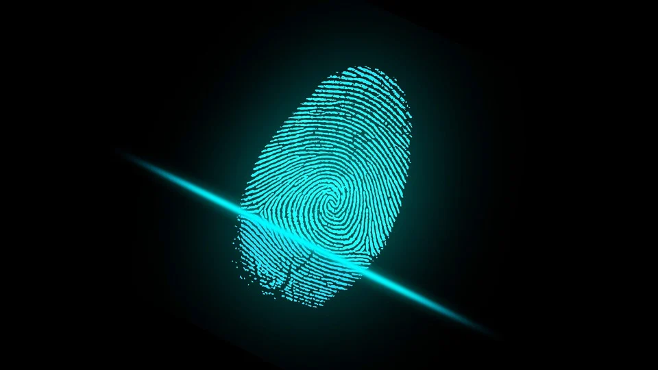 An image of a blue fingerprint with a line running in the middle against a black background.