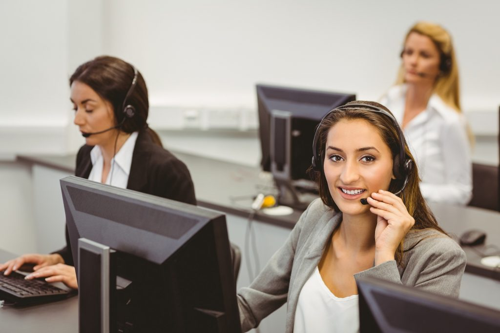 An image of a few call center/support executives assisting their customers.