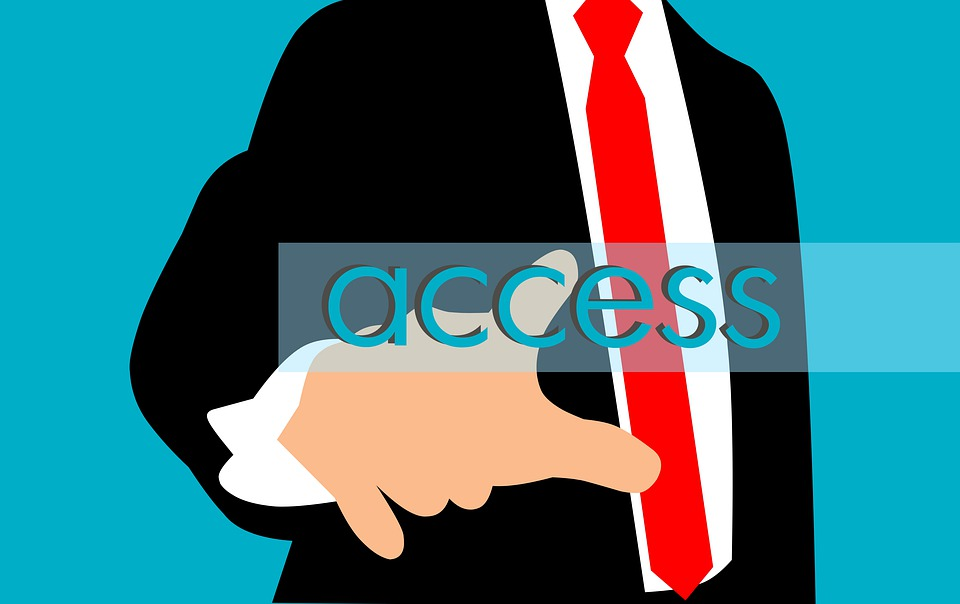 An illustration of a businessman touching the word access.