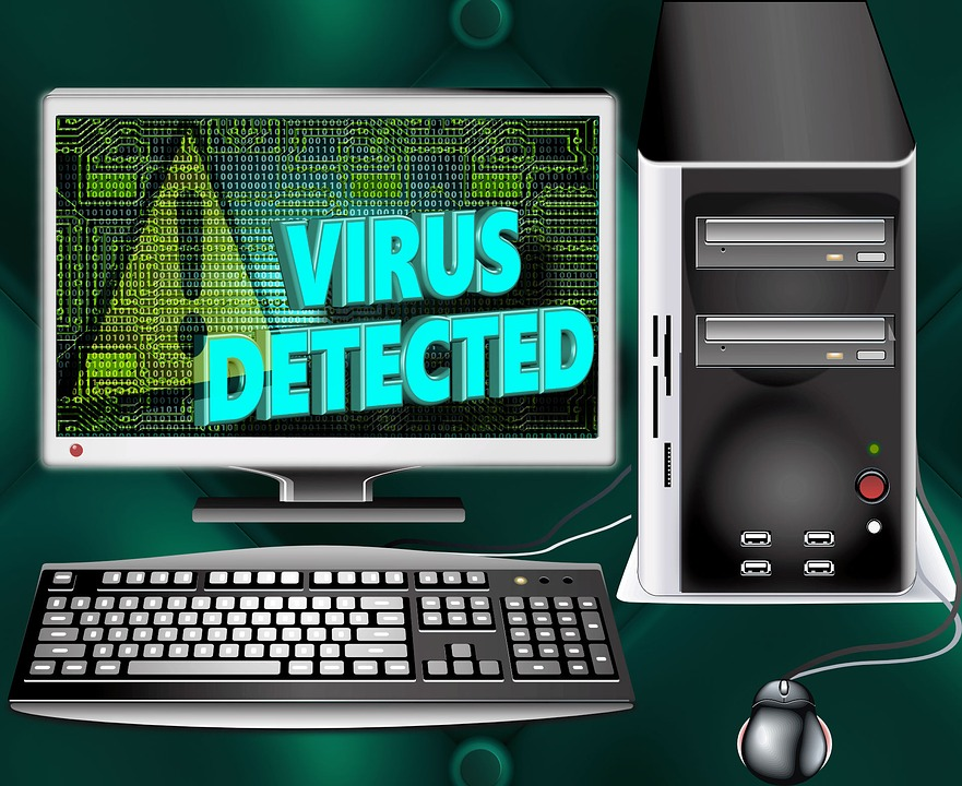 Image showing a computer with the words "virus detected" displayed on the monitor