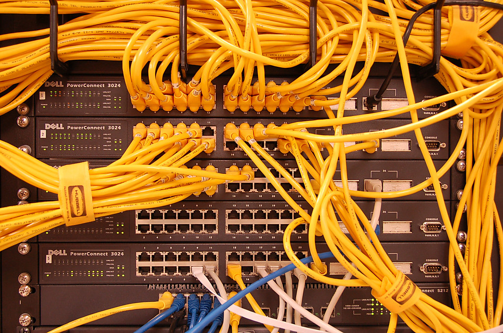 Image of switches with yellow LAN cables.