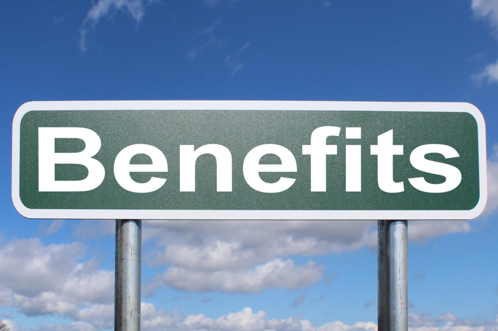 Image of a signpost with the word benefits written on it.