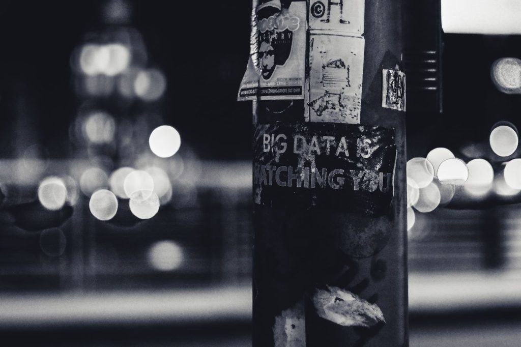 The image shows a post with stickers, one of which reads, "Big Data is watching you."